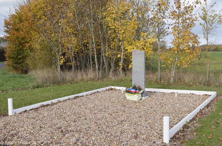 Set at the crossroads, the Memorial at Les Petites Cigognes commemorating the atrocities of 21st June 1940.